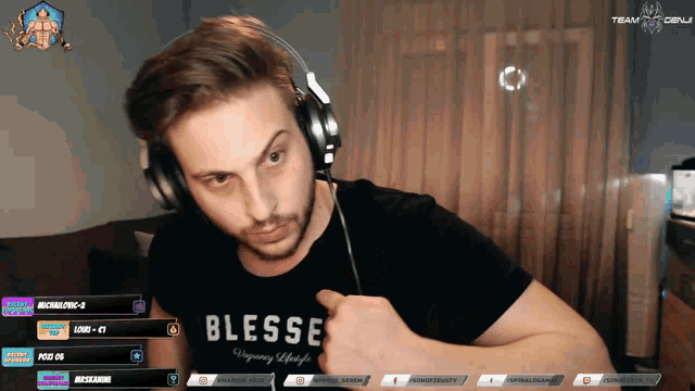 a man wearing headphones and a shirt that says blesse on it