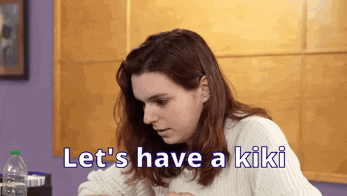 a woman sitting at a table with the words let 's have a kiki behind her