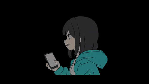 a girl in a blue hoodie is holding a cell phone .