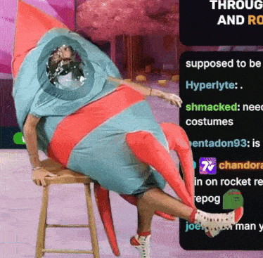 a person dressed in a rocket costume is sitting on a stool