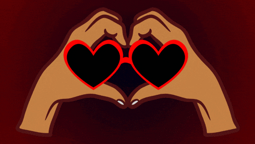 a pair of hands making a heart shape with sunglasses on