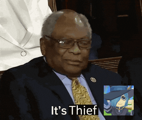 a man in a suit and tie with the words it 's thief below him