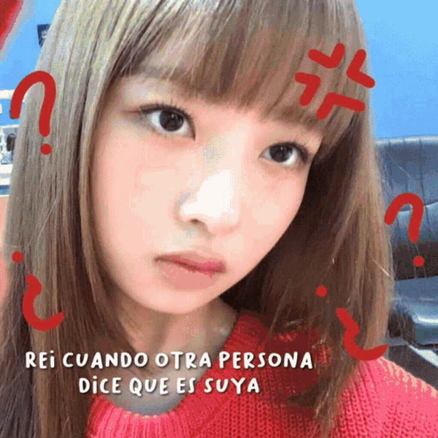 a woman in a red sweater with the words rei cuando otra persona dice que es suya above her
