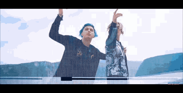 a man with blue hair is standing next to a man with white hair