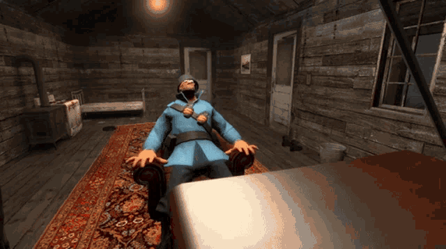 a man in a blue coat sits in a chair in a room