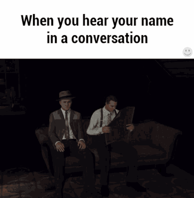 three men are sitting on a couch in a dark room and the caption says when you hear your name in a conversation