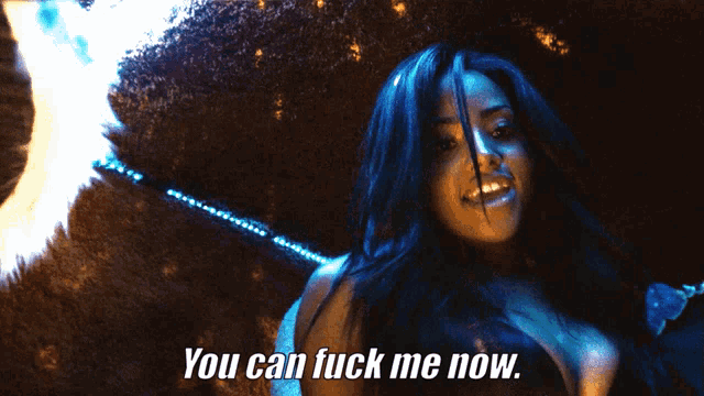 a woman says " you can fuck me now " in front of a dark background