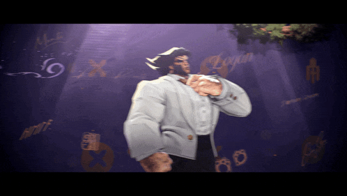 a man in a tuxedo stands in front of a wall that says logan