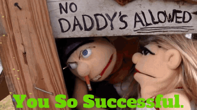 a sign that says no daddy 's allowed is behind two puppets