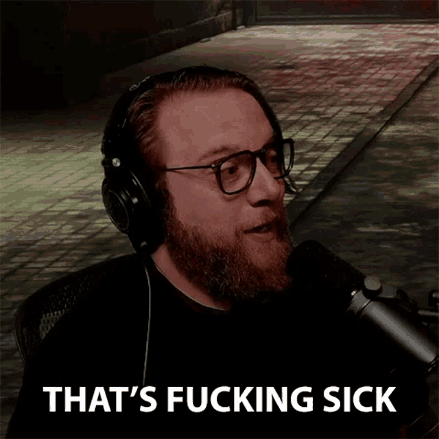 a bearded man wearing headphones and glasses says that 's fucking sick