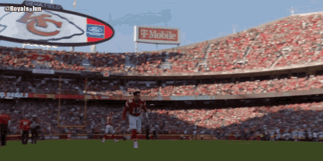 a t mobile sign hangs above a football field
