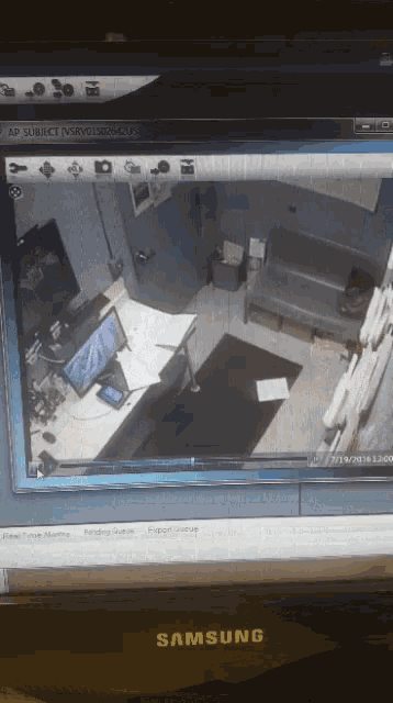 a samsung monitor displays a video of a room