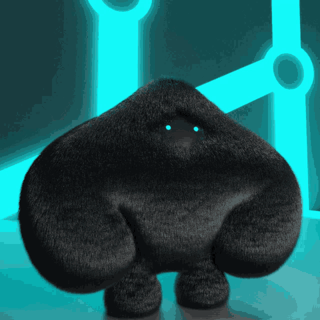 a black stuffed animal with blue eyes stands in front of a blue light