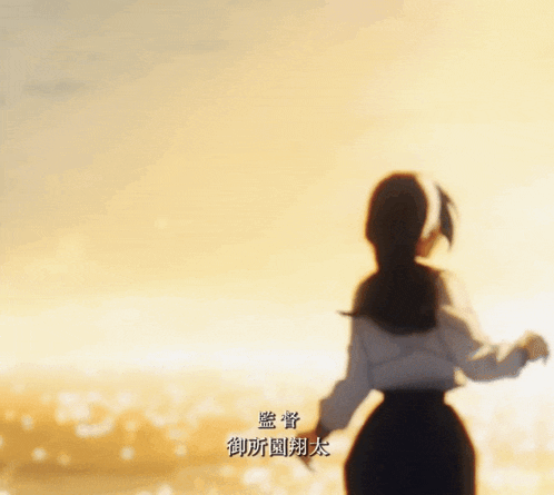 a girl in a school uniform is standing in front of the ocean