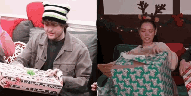 a man and a woman sitting on a couch with christmas presents
