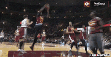 a basketball game is being played in front of an ad for firstenergy