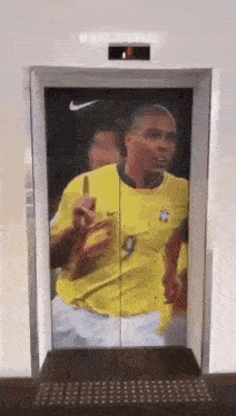 an elevator with a picture of a soccer player on the door