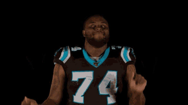a football player wearing a jersey with the number 74