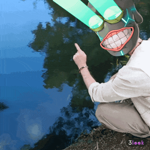 a man with a mask on his head is pointing at something in the water
