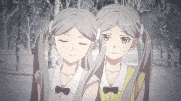 two girls with pigtails are standing next to each other