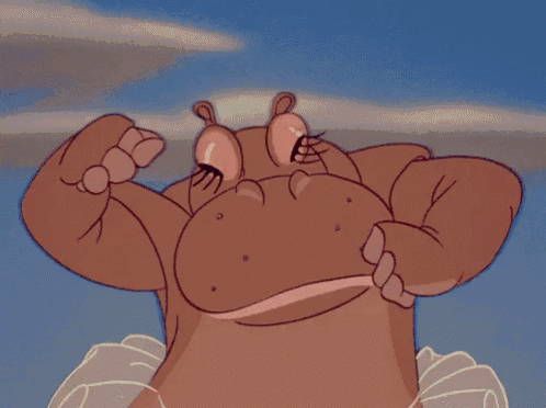 a close up of a cartoon character 's mouth with two marshmallows sticking out