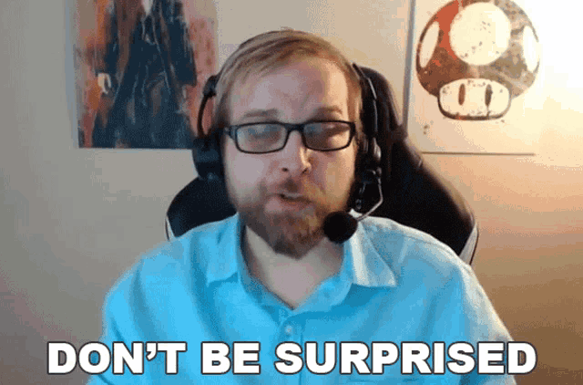 a man with glasses and a headset says " don 't be surprised "