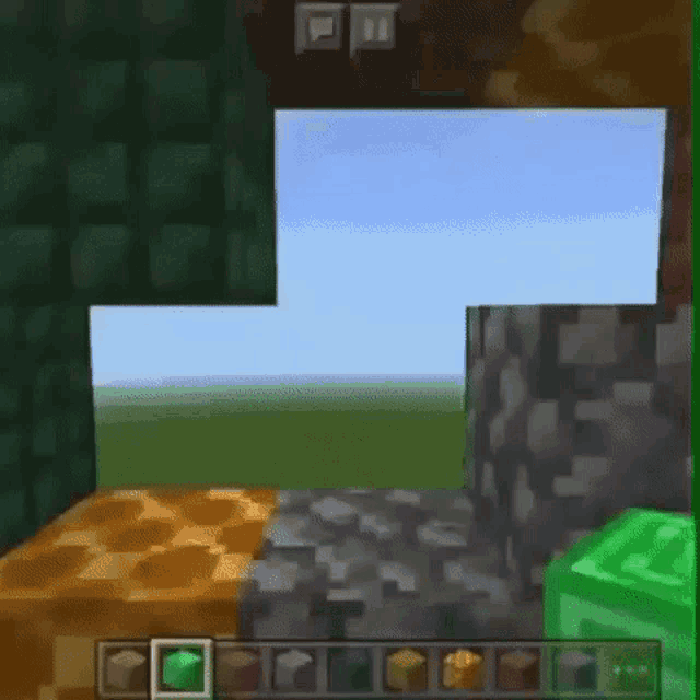 a person is playing a video game called minecraft on a phone .