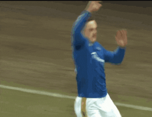 a soccer player wearing a blue shirt that says gazprom on it