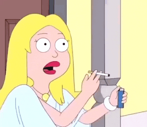 a cartoon woman is smoking a cigarette while holding a lighter .