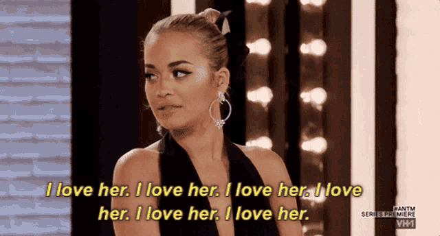 a woman in a black dress says i love her