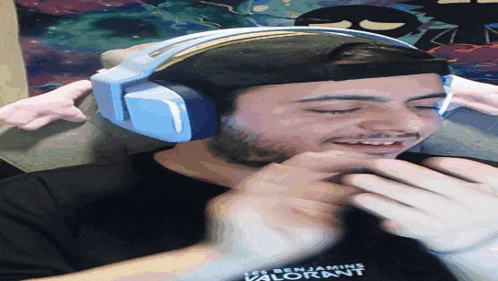a man wearing headphones is wearing a shirt that says benjamin valorant
