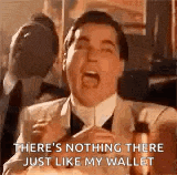 a man in a suit and tie is screaming and saying `` there 's nothing there just like my wallet `` .