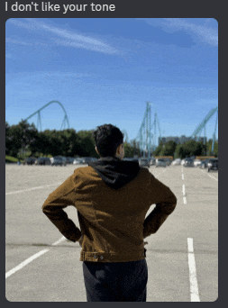 a man in a brown jacket is standing in a parking lot looking at a roller coaster ..