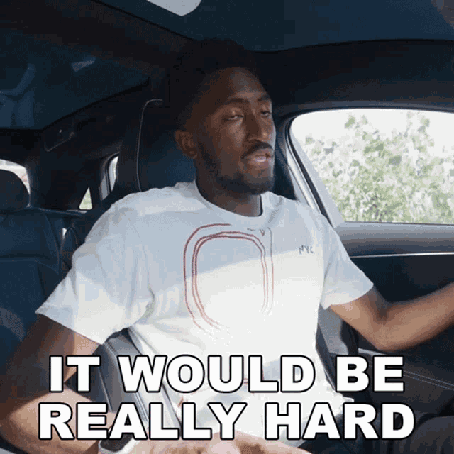 a man sitting in a car with the words it would be really hard below him