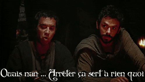 two men sitting next to each other with the words " ouais nan " written below them