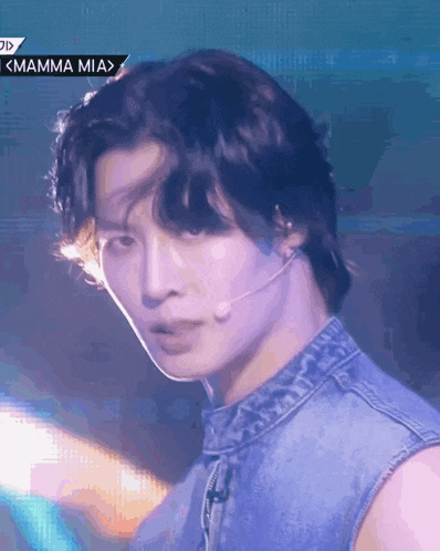 a close up of a man 's face with a mamma mia sign in the corner