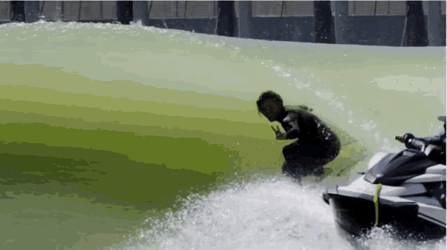 a man is riding a jet ski in the water