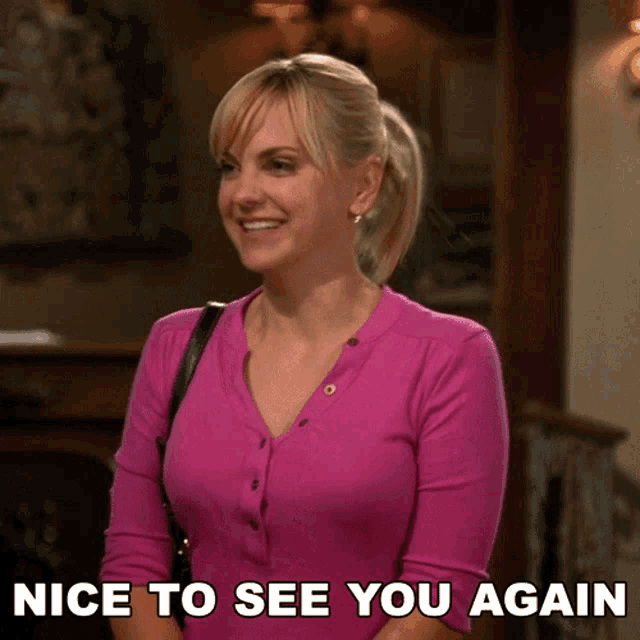 a woman in a pink shirt with the words nice to see you again below her