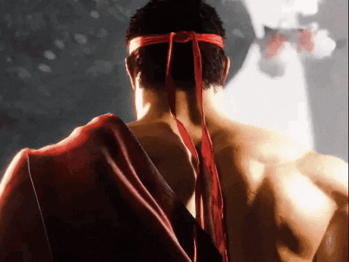 a man is wearing a red headband and a red robe