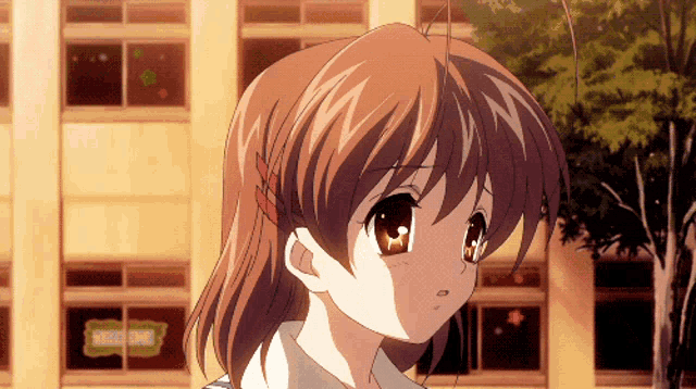 a girl with brown hair is standing in front of a building with a sign that says ' strawberry shop ' on it