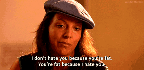 a woman wearing a flat cap says " i don t hate you because you 're fat "