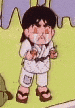 a cartoon character is standing in a field with his eyes closed and a tear running down his face .
