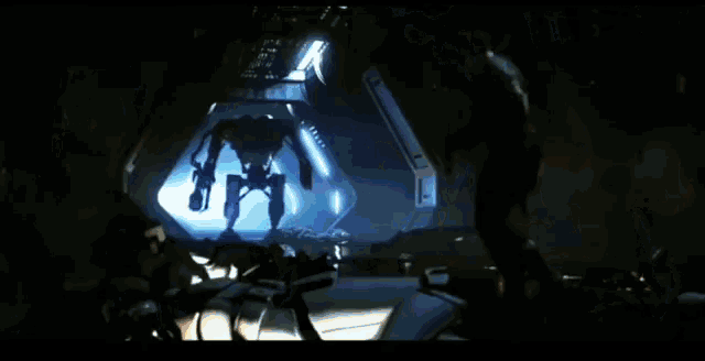 a robot is firing a flamethrower at another robot in a dark room