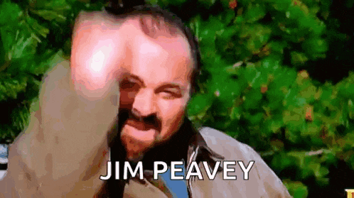 a man with a beard is making a funny face and the name jim peavey is on the bottom of the image .