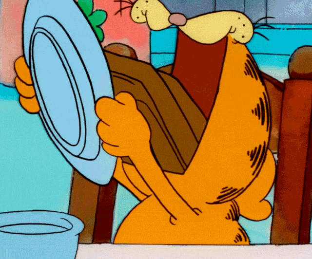 a cartoon cat is holding a blue plate