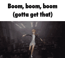 a woman is dancing in a room with the words boom boom boom ( gotta get that )