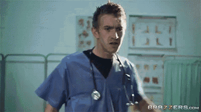 a man in scrubs with a stethoscope around his neck is in a hospital room .
