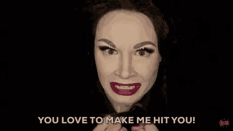 a drag queen is making a funny face and saying `` you love to make me hit you ! ''