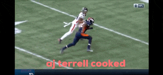 aj terrell is being chased by another player on the field