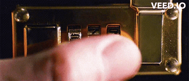 a close up of a person 's finger pressing a button with the word veed.no visible in the corner